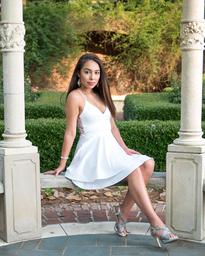 This is a portrait of a high school senior posed on a bench at Furman University.